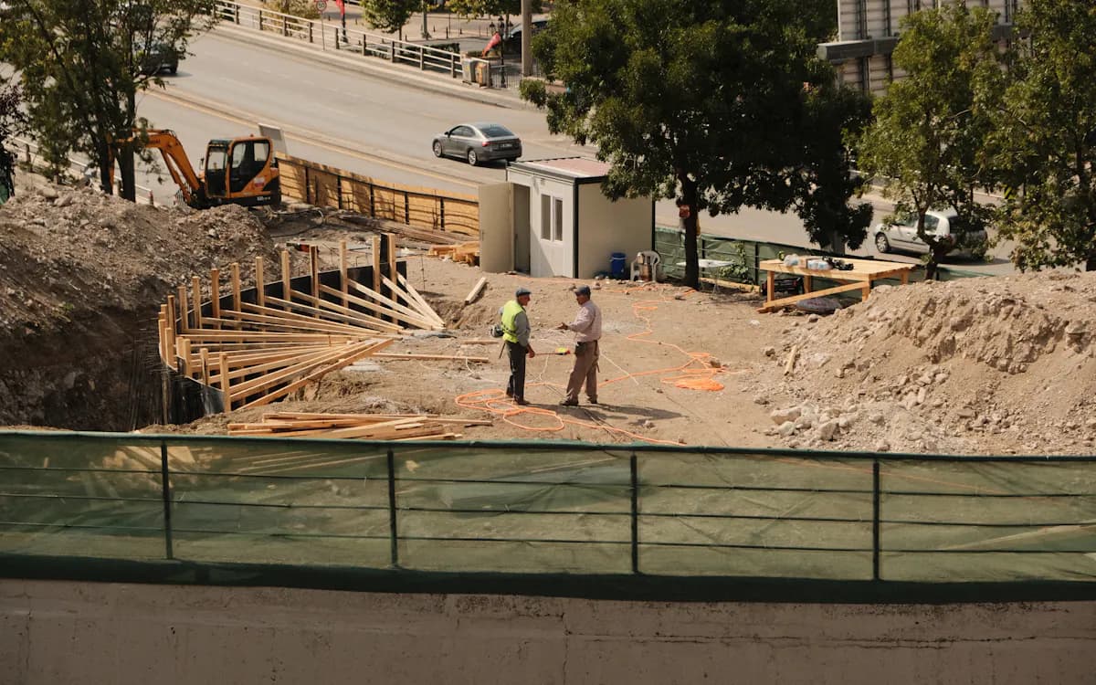 Construction consultant discussing site progress during inspection